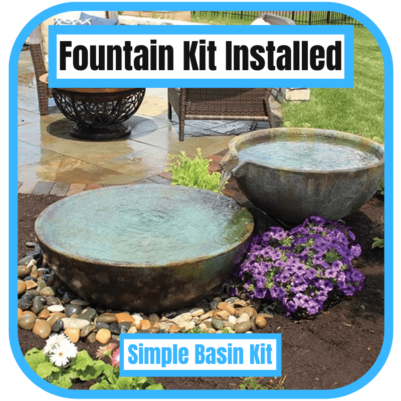 Completed fountain kit installation with decorative bowls and landscaping