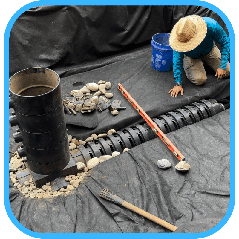 Pond liner and bottom drain installation