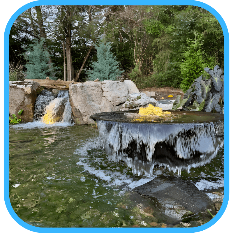 Icy frozen waterfall — a neglected water feature in winter
